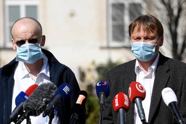 Doctor Martin Balik, left, and director of the General Teaching Hospital in Prague David Feltl, right, speak during a press conference on coronavirus treatment, on March 27, 2020, in Prague, Czech Republic. The condition of a Czech COVID-19 patient has markedly improved after the U.S. remdesivir experimental medicine was administered to him for three days. (CTKxPhoto MichalxKrumphanzl) CTKPhotoP202003270479601 kru 2