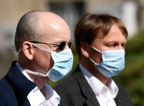 Doctor Martin Balik, left, and director of the General Teaching Hospital in Prague David Feltl, right, speak during a press conference on coronavirus treatment, on March 27, 2020, in Prague, Czech Republic. The condition of a Czech COVID-19 patient has markedly improved after the U.S. remdesivir experimental medicine was administered to him for three days. (CTKxPhoto MichalxKrumphanzl) CTKPhotoP202003270481101 kru 6