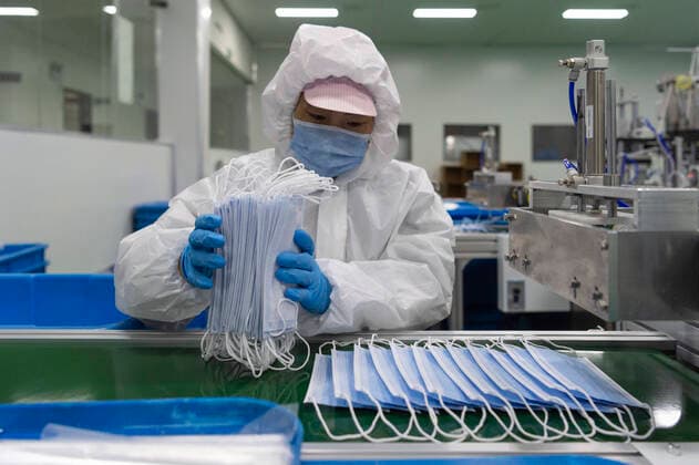 (200327) -- XIANGYANG, March 27, 2020 -- A worker makes face masks at a workshop in Xiangyang City, central China s Hubei Province, March 27, 2020. Amid stringent prevention measures against the virus, the companies of medical protective equipment production in Xiangyang introduced several production lines of protective gear, such as face masks and protective suits, which are not only used at home, but also exported abroad to help the fight against the COVID-19 globally. ) CHINA-HUBEI-XIANGYANG-MEDICAL SUPPLIES-PRODUCTION (CN) XiexJianfei 