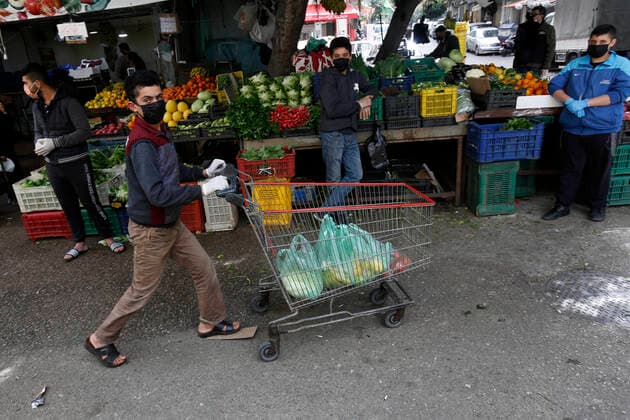 April 27, 2020, Beirut, Beirut, Lebanon: Lebanese wearing a mask as preventive measure against the coronavirus COVID-19 during a shopping at the Lebanese market, in Beirut, Lebanon, on March 27, 2020, as streets remain deserted after measures were taken in order to limit the spread of the Covid-19 coronavirus Beirut Lebanon - ZUMAap3_ 20200427_zaf_ap3_008 Copyright: xMarwanxTahtahx