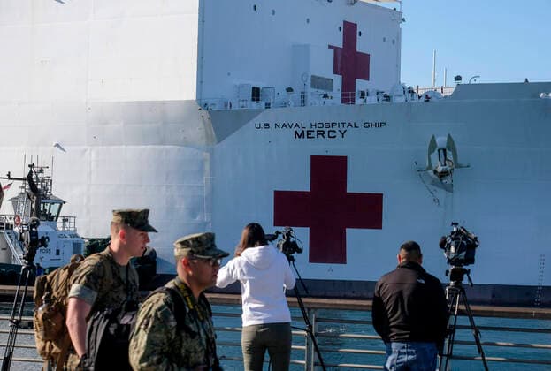 March 26, 2020, Los Angeles, California, U.S: The USNS Mercy Hospital Ship docks at the cruise ship terminal after arriving at the Port of Los Angeles on Friday, March 27, 2020. Mercy departed Naval Base San Diego Monday with more than 800 Navy medical personnel and support staff with the afloat medical treatment facility, and 70-plus civil service mariners who operate and navigate the ship, load and off-load mission cargo, assist with repairs to mission equipment and provide essential services to keep the medical facility up and running. Los Angeles U.S. - ZUMAc68_ 20200326_zaf_c68_030 Copyright: xRingoxChiux