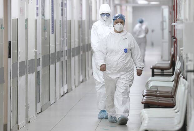 MOSCOW, RUSSIA - MARCH 27, 2020: Healthcare workers at Moscow s Filatov City Clinical Hospital No 15 starting to admit patients suspected of the COVID-19 infection. Stanislav Krasilnikov TASS  TS0D39F3