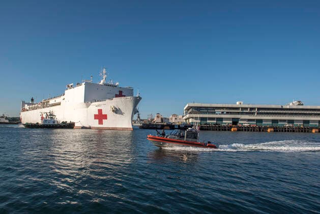 March 27, 2020, Los Angeles, California, USA: In this photo released by the United States Navy, the Military Sealift Command hospital ship USNS Mercy (T-AH 19) arrives in Los Angeles, California, March 27, 2020. Mercy deployed in support of the nation™s COVID-19 response efforts, and will serve as a referral hospital for non-COVID-19 patients currently admitted to shore-based hospitals. This allows shore base hospitals to focus their efforts on COVID-19 cases. One of the Department of Defense™s missions is Defense Support of Civil Authorities. DoD is supporting the Federal Emergency Management Agency, the lead federal agency, as well as state, local and public health authorities in helping protect the health and safety of the American people..Mandatory Credit: US Navy via CNP Los Angeles USA - ZUMAs152 20200327_zaa_s152_002 Copyright: xDavidxMorax