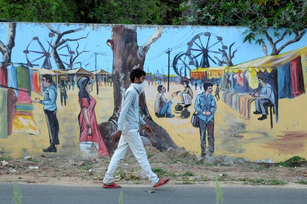 GURUGRAM, INDIA - MARCH 27: Migrant workers head back to their hometowns and villages on foot, on day 3 of the three week nationwide lockdown to check the spread of Coronavirus COVID-19 , near Sector 15 flyover on March 27, 2020 in Gurugram, India. (Photo by Parveen Kumar Hindustan Times) Hit By Lockdown, Migrant Workers Walk To Reach Homes