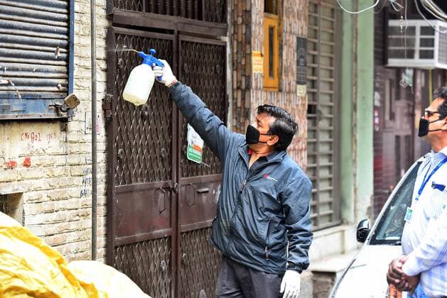 NEW DELHI, INDIA - MARCH 27: An EDMC employee chemically disinfects houses on the third day of the national lockdown imposed by Prime Minister Narendra Modi to curb the spread of Coronavirus COVID-19 , at Pandav Nagar, on March 27, 2020 in New Delhi, India. (Photo by Raj K Raj Hindustan Times) Sanitation Drive In India To Prevent Covid-19
