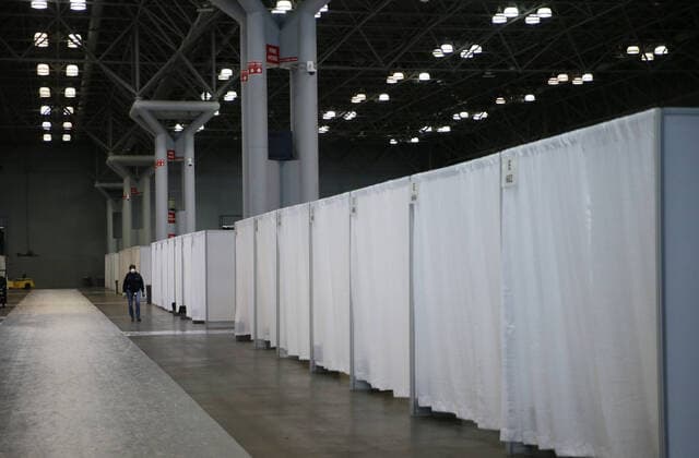 Newly erected hospital rooms sectioned off with white curtains are on display after Gov. Andrew Cuomo speaks with the New York National Guard on site at the Jacob K. Javits Convention Center in New York City on Friday, March 27, 2020. The Javits Center is setting up to be turned into field hospitals to test and possibly treat cases of COVID-19 infections. Almost half of the United States are under stay-at-home orders and the United States has become the country with the most confirmed coronavirus cases at over 94,000.  NYP20200327112 JOHNxANGELILLO