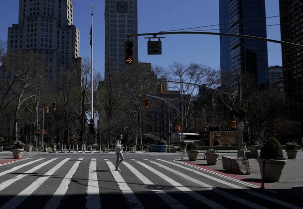 Pedestrian and vehicle traffic remains quiet at Madison Square Park and Flatiron Public Plaza in New York City on Friday, March 27, 2020. Almost half of the United States are under stay-at-home orders and the United States has become the country with the most confirmed coronavirus cases at over 94,000.  NYP20200327111 JOHNxANGELILLO
