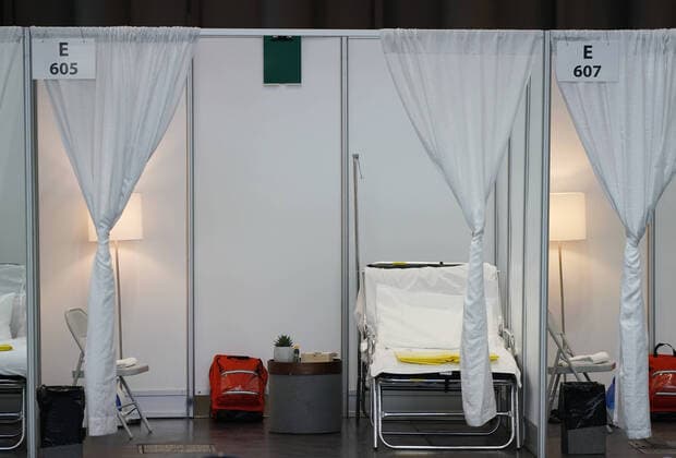 Newly erected hospital rooms sectioned off with white curtains are on display after Gov. Andrew Cuomo speaks with the New York National Guard on site at the Jacob K. Javits Convention Center in New York City on Friday, March 27, 2020. The Javits Center is setting up to be turned into field hospitals to test and possibly treat cases of COVID-19 infections. Almost half of the United States are under stay-at-home orders and the United States has become the country with the most confirmed coronavirus cases at over 94,000.  NYP20200327118 JOHNxANGELILLO