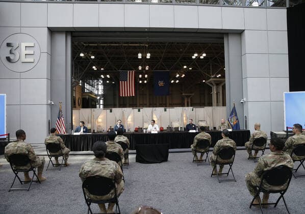 Gov. Andrew Cuomo speaks with the New York National Guard on site at the Jacob K. Javits Convention Center in New York City on Friday, March 27, 2020. The Javits Center is setting up to be turned into field hospitals to test and possibly treat cases of COVID-19 infections. Almost half of the United States are under stay-at-home orders and the United States has become the country with the most confirmed coronavirus cases at over 94,000.  NYP20200327120 JOHNxANGELILLO