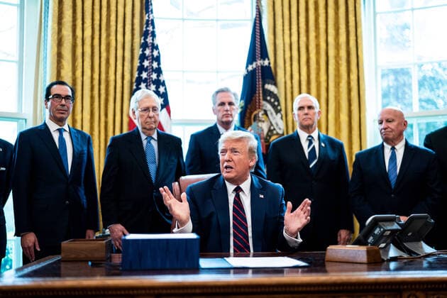 President Donald Trump participates in a signing ceremony for a two trillion dollar coronavirus relief bill in the Oval Office at the White House in Washington, DC on March 27, 2020. The economic stimulus package, the largest in U.S. history, provides economic bailouts to companies, independent contractors and includes direct payments to individuals as the U.S. suffers from the COVID-19 pandemic.  WAX20200327408 ERINxSCHAFF