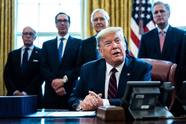 President Donald Trump participates in a signing ceremony for a two trillion dollar coronavirus relief bill in the Oval Office at the White House in Washington, DC on March 27, 2020. The economic stimulus package, the largest in U.S. history, provides economic bailouts to companies, independent contractors and includes direct payments to individuals as the U.S. suffers from the COVID-19 pandemic.  WAX20200327414 ERINxSCHAFF