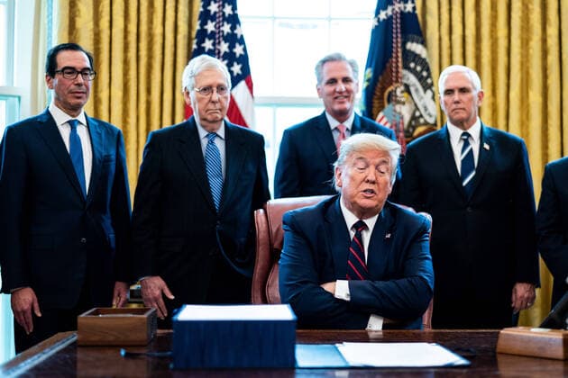 President Donald Trump participates in a signing ceremony for a two trillion dollar coronavirus relief bill in the Oval Office at the White House in Washington, DC on March 27, 2020. The economic stimulus package, the largest in U.S. history, provides economic bailouts to companies, independent contractors and includes direct payments to individuals as the U.S. suffers from the COVID-19 pandemic.  WAX20200327404 ERINxSCHAFF