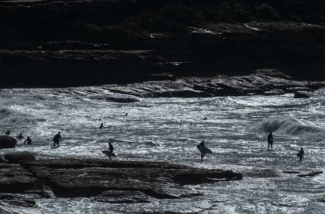 AUSTRALIA CORONAVIRUS COVID-19, Surfers in the water near Tamarama Beach, in Sydney, Saturday, March 28, 2020. The Australian Federal Government have introduced strict social distancing rules in an effort to contain the COVID-19 Coronavirus pandemic. ( NO ARCHIVING, EDITORIAL USE ONLY, NO USE IN BOOKS WITHOUT CONSENT SYDNEY NSW AUSTRALIA  Copyright: xJAMESxGOURLEYx 20200328001460531231