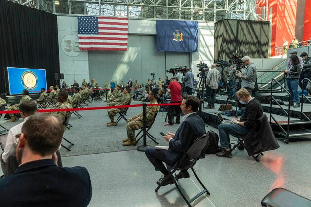 NY: Andrew Cuomo addresses National Guard members National Guard members and media attend Governor Andrew Cuomo address praising complition of makeshift hospitals at Jacob Javits Center New York New York United States Copyright: LevxRadin
