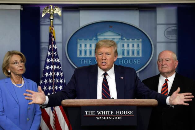March 27, 2020, Washington, District of Columbia, USA: United States President Donald J. Trump speaks between US Secretary of Education Betsy DeVos, left, and US Secretary of Agriculture Sonny Perdue and Agriculture Secretary Sonny Perdue during a press briefing on the Coronavirus COVID-19 pandemic with members of the Coronavirus Task Force at the White House in Washington, DC on March 27, 2020. .Credit: Pool via CNP Washington USA - ZUMAs152 20200327_zaa_s152_080 Copyright: xYurixGripasx
