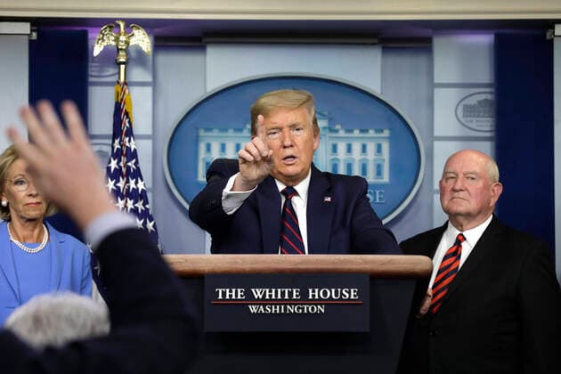 March 27, 2020, Washington, District of Columbia, USA: United States President Donald J. Trump speaks between US Secretary of Education Betsy DeVos, left, and US Secretary of Agriculture Sonny Perdue and Agriculture Secretary Sonny Perdue during a press briefing on the Coronavirus COVID-19 pandemic with members of the Coronavirus Task Force at the White House in Washington, DC on March 27, 2020. .Credit: Pool via CNP Washington USA - ZUMAs152 20200327_zaa_s152_081 Copyright: xYurixGripasx