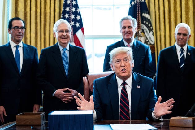 United States President Donald J. Trump makes remarks during a signing ceremony for a two trillion dollar coronavirus relief bill in the Oval Office at the White House in Washington, DC on March 27, 2020. Standing behind the President from left to right: US Secretary of the Treasury Steven T. Mnuchin; US Senate Majority Leader Mitch McConnell (Republican of Kentucky); US House Minority Leader Kevin McCarthy (Republican of California) and US Vice President Mike Pence. Copyright: xErinxSchaffx
