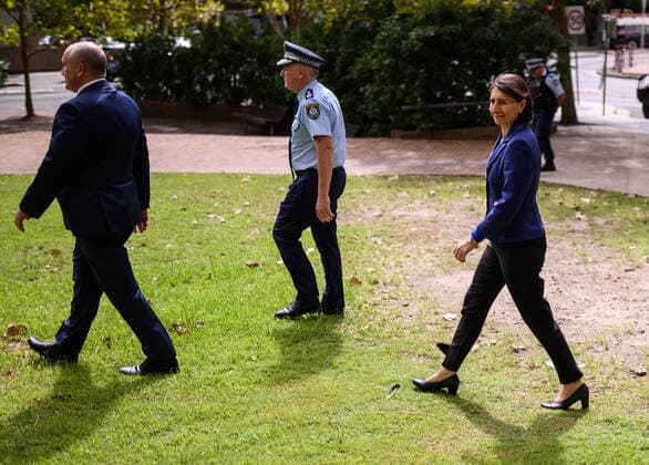 GLADYS BEREJIKLIAN CORONAVIRUS PRESSER, NSW Minister for Police David Elliot, NSW Police Commissioner and NSW Premier Gladys Berejiklian arrive at a press conference to provide an update on the COVID-19 pandemic in NSW, Sydney, Saturday, March 28, 2020. ( NO ARCHIVING, EDITORIAL USE ONLY, NO USE IN BOOKS WITHOUT CONSENT SYDNEY NSW AUSTRALIA  Copyright: xJAMESxGOURLEYx 20200328001460541758