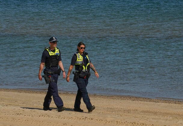 AUSTRALIA CORONAVIRUS COVID-19, Police officers patrol St Kilda Beach in Melbourne, Saturday, March 28, 2020. Port Phillip City Council has clamped down on large groups accessing all of its beaches including the popular St Kilda Beach. A shutdown of non-essential services is in effect Australia wide in a bid to slow the spread of the coronavirus (COVID-19) disease. ( NO ARCHIVING, EDITORIAL USE ONLY, NO USE IN BOOKS WITHOUT CONSENT MELBOURNE VIC AUSTRALIA  Copyright: xSCOTTxBARBOURx 20200328001460556523