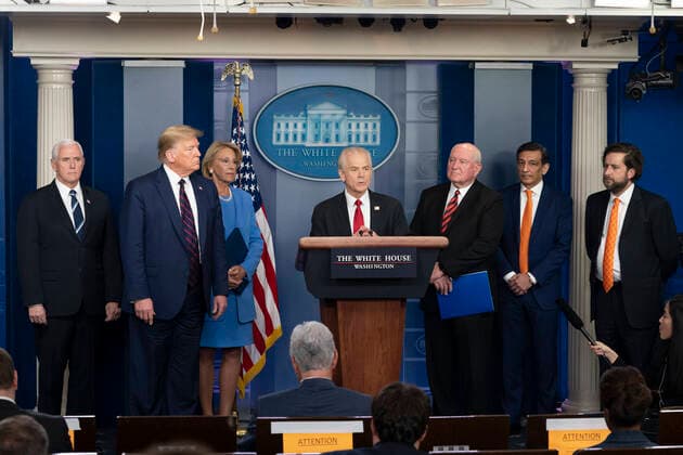 March 27, 2020, Washington, The District of Columbia, United States Of America: President Donald J. Trump, joined by Vice President Mike Pence and member of the Cabinet and the White House Coronavirus Task Force, listens as Director of Trade and Manufacturing Policy Peter Navarro delivers remarks after being appointed as the National Defense Production Act Policy Coordinator during a coronavirus update briefing Friday, March 27, 2020, in the James S. Brady Press Briefing Room of the White House ..People: President Donald J. Trump, Peter Navarro Washington United States Of America - ZUMAs214 20200327_zaa_s214_007 Copyright: xSMGx