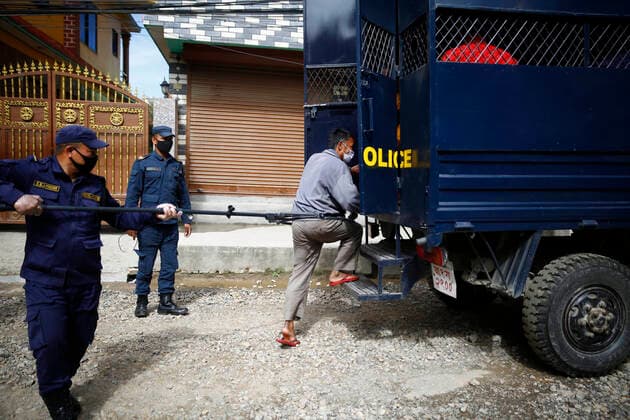 March 28, 2020, Kathmandu, Nepal: A policeman arresting a lockdown violator using a multifunctional device that lets him maintain social distance on the fifth day of government imposed nationwide lockdown amid concerns over the coronavirus pandemic in Kathmandu, Nepal on Saturday, March 28, 2020. Kathmandu Nepal - ZUMAg200 20200328_zap_g200_007 Copyright: xSkandaxGautamx