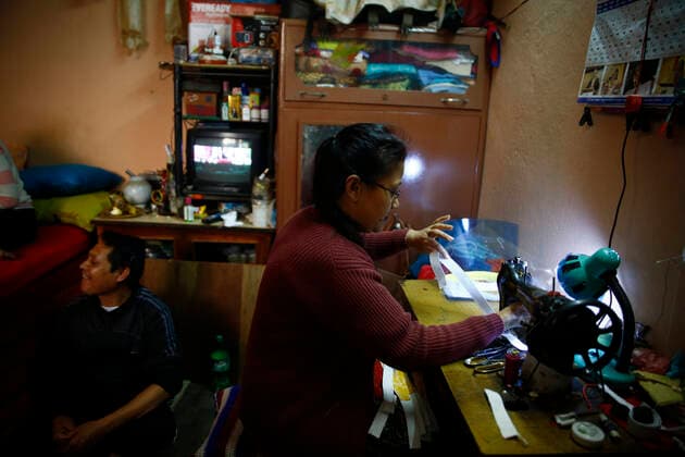 March 28, 2020, Kathmandu, Nepal: A woman makes free face shields in their rented room for security personnel, journalists and people on duty on the fifth day of government imposed lockdown amid concerns over coronavirus pandemic in Kathmandu, Nepal on Saturday, March 28, 2020. Kathmandu Nepal - ZUMAg200 20200328_zap_g200_009 Copyright: xSkandaxGautamx