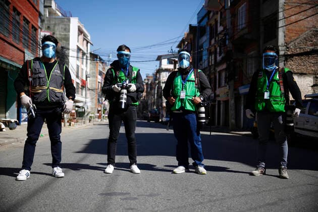 March 28, 2020, Kathmandu, Nepal: Photojournalists pose for a group photo after receiving without charge face shields from a group of local people of Dillibazar on the fifth day of government imposed lockdown amid concerns over coronavirus pandemic in Kathmandu, Nepal on Saturday, March 28, 2020. Kathmandu Nepal - ZUMAg200 20200328_zap_g200_013 Copyright: xSkandaxGautamx