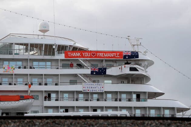 COVID-19 CRUISE PASSENGERS PERTH, Banners are hung from the cruise ship MV Artania in Fremantle harbour in Fremantle, Saturday, March 28, 2020. Nine people confirmed or suspected of being infected with coronavirus have disembarked from the MV Artania cruise ship and will be treated in Perth. None of the 800 passengers or 500 crew onboard are Australian, with the majority coming from Germany.( NO ARCHIVING, EDITORIAL USE ONLY, NO USE IN BOOKS WITHOUT CONSENT PERTH WA AUSTRALIA  Copyright: xRICHARDxWAINWRIGHTx 20200328001460578017