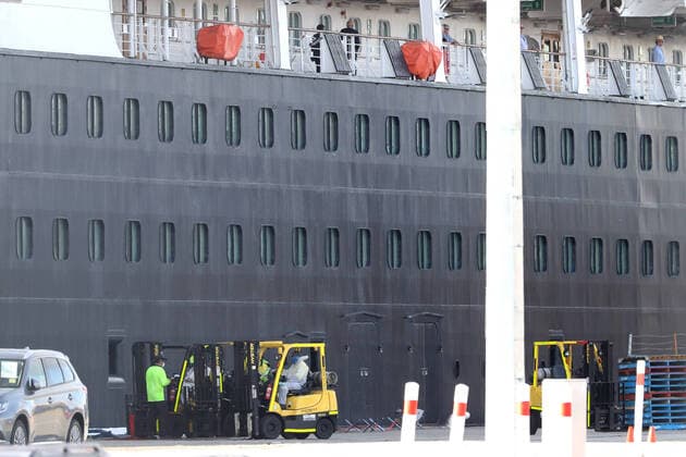 COVID-19 CRUISE PASSENGERS PERTH, Workers, some in protective clothing are seen next to the cruise ship Vasco da Gama in Fremantle harbour in Fremantle, Saturday, March 28, 2020. 800 Australian passengers from the Vasco da Gama cruise ship will be quarantined either on WA s Rottnest Island or in a hotel for two weeks. ( NO ARCHIVING, EDITORIAL USE ONLY, NO USE IN BOOKS WITHOUT CONSENT PERTH WA AUSTRALIA  Copyright: xRICHARDxWAINWRIGHTx 20200328001460578223