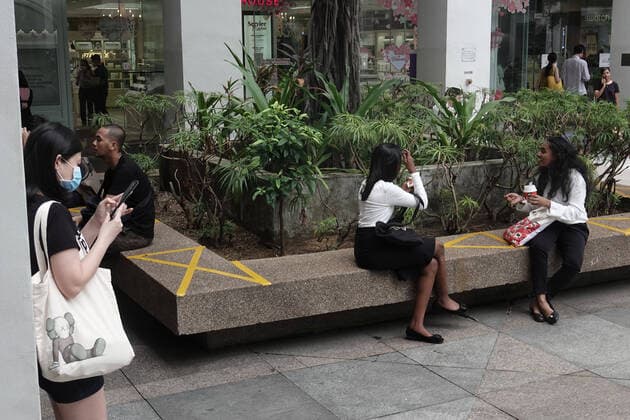 (200328) -- SINGAPORE, March 28, 2020 (Xinhua) -- A shopping mall implements social distancing measures by marking public sitting area with cross in Singapore Bugis area on March 28, 2020. (Photo by Then Chih Wey Xinhua) SINGAPORE-COVID-19-SOCIAL DISTANCING 