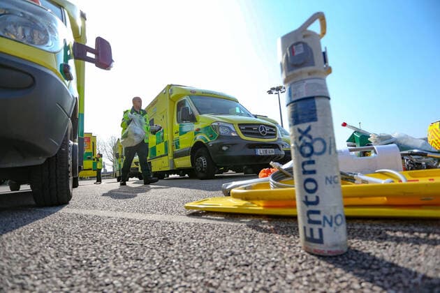 BRITAIN VIRUS OUTBREAK - NHS Support Unit personnel is seen setting up medical support hardware equipment at the ExCel Centre in London on Saturday, March 28, 2020. NHS Nightingale makeshift hospital is being made into a temporary 4000-bed, comprising of two wards, each of 2,000 people, to help tackle the coronavirus outbreak in Britain. (Photo Vudi Xhymshiti)  iMagoVX