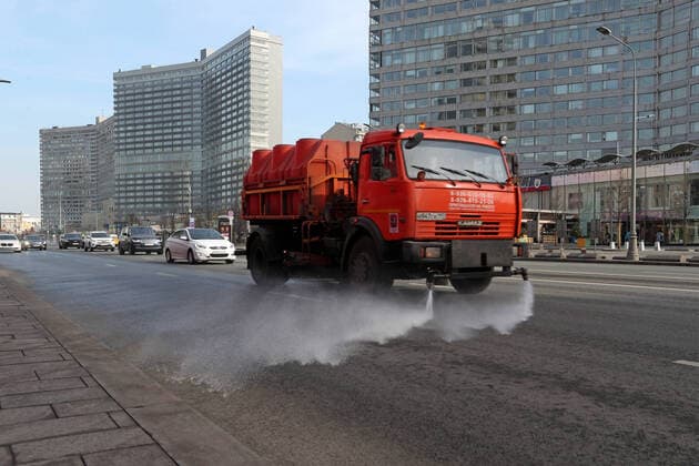 MOSCOW, RUSSIA - MARCH 28, 2020: A street sweeper with water jets washes the road on Novy Arbat Street amid the ongoing COVID-19 pandemic. Vladimir Gerdo TASS  TS0D3B3A