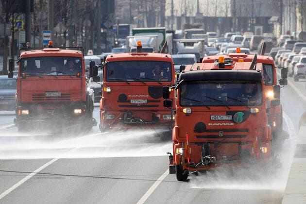 MOSCOW, RUSSIA - MARCH 28, 2020: Street sweepers with water jets clean the carriageway in Garden Ring street in central Moscow. Since 5 March, Moscow has been on high alert in connection with the pandemic of the novel coronavirus (COVID-19). Streets and other public areas are cleaned and disinfected to counter the spread of the novel coronavirus. As of 28 March 2020, Russia has reported more than 1200 confirmed cases of the novel coronavirus (COVID-19), with more than 800 confirmed cases in Moscow. Sergei Bobylev TASS  TS0D3B01