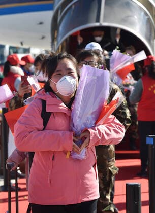 (200328) -- CHANGBAISHAN, March 28, 2020 -- Medical workers supporting virus-hit Hubei Province arrive at Changbaishan Airport in northeast China s Jilin Province, March 28, 2020. The third batch of medical assistance teams from Jilin, which consists of 404 members, returned from Hubei as the epidemic outbreak in the hard-hit province has been subdued. ) CHINA-JILIN-MEDICAL TEAM-RETURN FROM HUBEI (CN) LinxHong 
