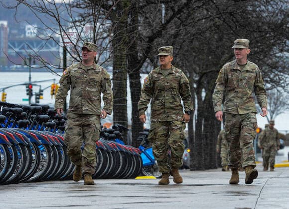 March 28, 2020, New York Manhattan, USA: Army National Guard walking out side the The Javits Convention Center. New York Gov. Andrew Cuomo announced the construction of a temporary hospital at the the Jacob K. Javits Center had been completed with the help of FEMA and the National Guard. New York State has over 26,000 cases and 450 people died from the pandemic in NYS in the past 24 hours. 03 28 20. New York Manhattan. . New York Manhattan. USA - ZUMAs252 20200328_znp_s252_015 Copyright: xMarcusxSantosx