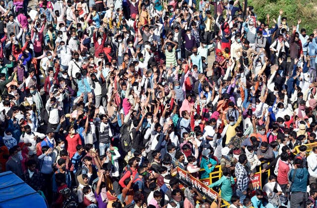 NEW DELHI, INDIA - MARCH 28: Migrants workers heading towards their home were assembled by police personnel at National Highway 24 (Delhi- UP border) on Day 4 of the 21 day nationwide lockdown -- to check the spread of coronavirus, on March 28, 2020 in New Delhi, India. (Photo by Ajay Aggarwal Hindustan Times ) Coronavirus Update: Amid Lockdown, A Sea Of Migrants In Delhi-NCR Try To Find Their Way Back Home