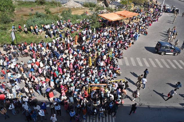 NEW DELHI, INDIA - MARCH 28: Migrants workers heading towards their home were assembled by police personnel at National Highway 24 (Delhi- UP border) on Day 4 of the 21 day nationwide lockdown -- to check the spread of coronavirus, on March 28, 2020 in New Delhi, India. (Photo by Ajay Aggarwal Hindustan Times ) Coronavirus Update: Amid Lockdown, A Sea Of Migrants In Delhi-NCR Try To Find Their Way Back Home