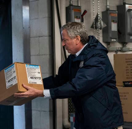 NY: UN donation of facial masks to fight COVID-19 Mayor Bill de Blasio helps load boxes of facial masks donated by UN Secretary-General Antonio Guterres & US Ambassador Kelly Craft at UN garage New York New York United States Copyright: LevxRadin