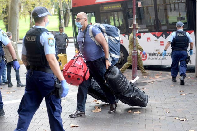 AUSTRALIA CORONAVIRUS COVID-19, Returning overseas travellers are ushered into the InterContinental Hotel for the beginning of their 14-day imposed quarantine in Sydney, Sunday, March 29, 2020. ( NO ARCHIVING, EDITORIAL USE ONLY, NO USE IN BOOKS WITHOUT CONSENT SYDNEY NSW AUSTRALIA  Copyright: xJEREMYxPIPERx 20200329001460666676