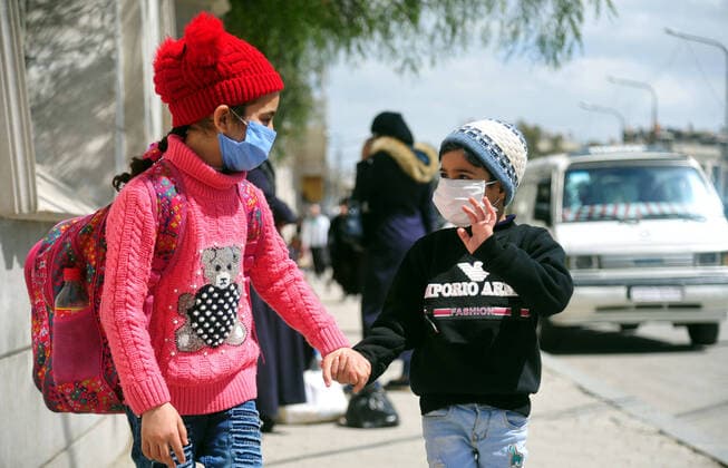 (200329) -- DAMASCUS, March 29, 2020 -- Kids are seen wearing masks in Damascus, capital of Syria, on March 28, 2020. Syria has so far registered five coronavirus cases. (Photo by Xinhua) SYRIA-DAMASCUS-COVID-19-FIVE CASES AmmarxSafarjalani 