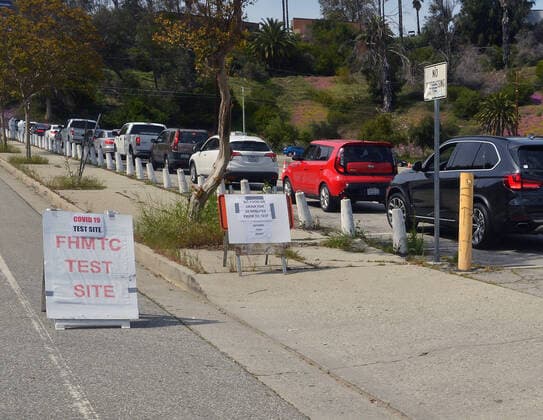 Medical and fire department personnel distribute self-testing coronavirus kits to residents who made appointments in a parking lot adjacent to Dodger Stadium in Los Angeles on Saturday, March 28, 2020. The number of confirmed cases of COVID-19, the disease caused by the.coronavirus in Los Angeles County stood at 1,465 as of midday Saturday, with 26 deaths. The county s Department of Public Health reported 257 new cases on Friday, and 421 on Thursday, the highest one-day total so far.  LAP2020032803 JIMxRUYMEN