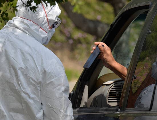 Medical and fire department personnel distribute self-testing coronavirus kits to residents who made appointments, in a parking lot adjacent to Dodger Stadium in Los Angeles on Saturday, March 28, 2020. The number of confirmed cases of COVID-19, the disease caused by the.coronavirus in Los Angeles County stood at 1,465 as of midday Saturday, with 26 deaths. The county s Department of Public Health reported 257 new cases on Friday, and 421 on Thursday, the highest one-day total so far.  LAP2020032807 JIMxRUYMEN