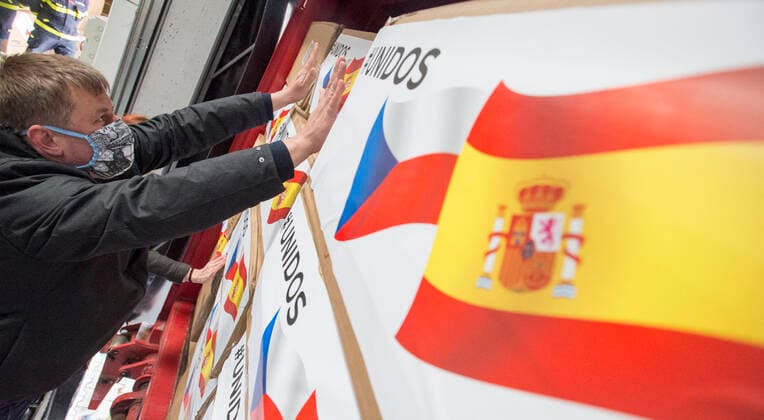 Czech Foreign Affairs Minister Tomas Petricek (Social Democrats, CSSD) prepares boxes with an aid, in Opocinek, Pardubice, Czech Republic, on March 29, 2020. The Czech Republic launched its aid to Spain and Italy, the European countries that are the most afflicted by the novel coronavirus pandemic, sending 20,000 protective suits from the police storage facility in Opocinek to them. (CTKxPhoto JosefxVostarek) CTKPhotoP202003290113501 JVO 005