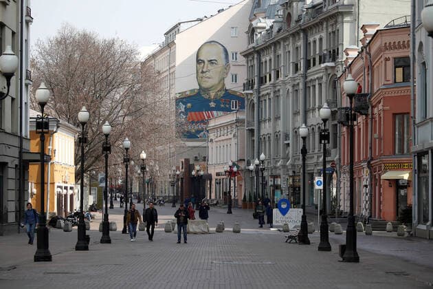 MOSCOW, RUSSIA - MARCH 29, 2020: A nearly deserted pedestrian street, Stary Arbat, in central Moscow during the pandemic of the novel coronavirus (COVID-19). Seen behind is a mural depicting Soviet Marshal Georgy Zhukov. As of 29 March 2020, Russia has reported more than 1200 confirmed cases of the novel coronavirus (COVID-19), with more than 1000 confirmed cases in Moscow. Artyom Geodakyan TASS  TS0D3C45