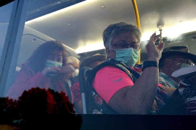 COVID-19 CRUISE PASSENGERS PERTH, Passengers from the cruise ship MS Artania are seen arriving at Perth International airport on TransPerth buses before boarding a Condor Airlines charter flight back to Germany on Sunday, March 29, 2020. Four Condor Airlines charter flights are scheduled to arrive from Frankfurt in Germany via Phuket in Thailand to repatriate passengers from the coronavirus-infected cruise ship MS Artania which docked in Fremantle harbour on Friday with approximately 800 passengers, mostly from Germany and 500 crew on board. Nine passengers and crew from the vessel have tested positive for coronavirus and were taken to hospitals in Perth. Another 46 people were showing virus-type symptoms. ( NO ARCHIVING, EDITORIAL USE ONLY, NO USE IN BOOKS WITHOUT CONSENT PERTH WA AUSTRALIA  Copyright: xRICHARDxWAINWRIGHTx 20200329001460703491