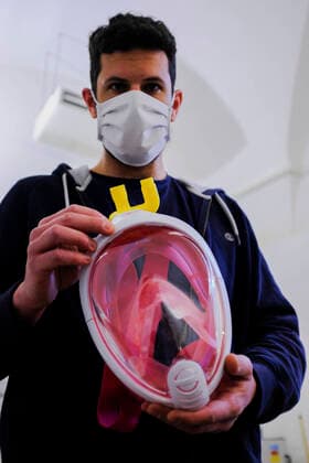 Raniero Madonna holds a snorkeling mask distributed by Decathlon equipped with an adapter that transforms it into an oxygen surgery mask to improve the care for Sars-Cov2 patients seriously ill in Italians hospitals in Remade 3D graphics laboratory that participate to a project made by Isinnova who shared his idea. In Italy hospitals are almost full and more intensive care equipment is needed.  Copyright: xAntonioxBalascox xIPAx xAntonioxBalascox