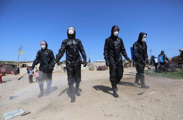 March 29, 2020, Khan Younis, Gaza Strip, Palestinian Territory: Palestinian workers spray disinfectant as a preventive measure amid fears of the spread of the coronavirus at Nahr al-Bared refugee camp in Khan Younis in the southern Gaza Strip on March 29, 2020 Khan Younis Palestinian Territory - ZUMAap3_ 20200329_zaf_ap3_005 Copyright: xAshrafxAmrax