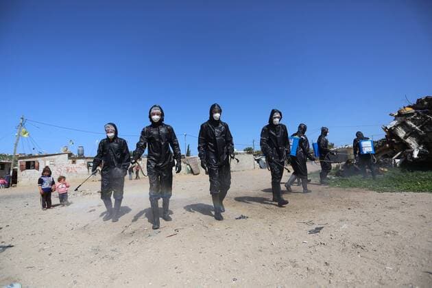 March 29, 2020, Khan Younis, Gaza Strip, Palestinian Territory: Palestinian workers spray disinfectant as a preventive measure amid fears of the spread of the coronavirus at Nahr al-Bared refugee camp in Khan Younis in the southern Gaza Strip on March 29, 2020 Khan Younis Palestinian Territory - ZUMAap3_ 20200329_zaf_ap3_024 Copyright: xAshrafxAmrax