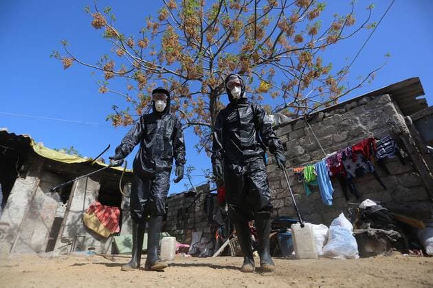 March 29, 2020, Khan Younis, Gaza Strip, Palestinian Territory: Palestinian workers spray disinfectant as a preventive measure amid fears of the spread of the coronavirus at Nahr al-Bared refugee camp in Khan Younis in the southern Gaza Strip on March 29, 2020 Khan Younis Palestinian Territory - ZUMAap3_ 20200329_zaf_ap3_038 Copyright: xAshrafxAmrax