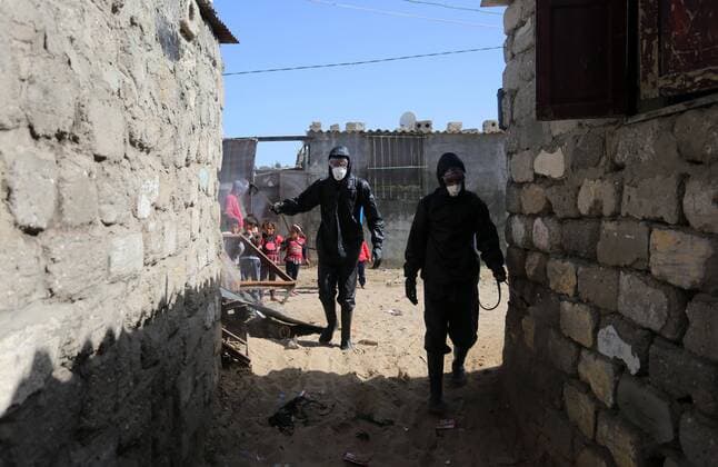 March 29, 2020, Khan Younis, Gaza Strip, Palestinian Territory: Palestinian workers spray disinfectant as a preventive measure amid fears of the spread of the coronavirus at Nahr al-Bared refugee camp in Khan Younis in the southern Gaza Strip on March 29, 2020 Khan Younis Palestinian Territory - ZUMAap3_ 20200329_zaf_ap3_056 Copyright: xAshrafxAmrax